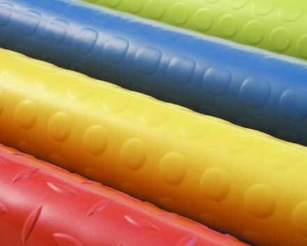 Multicolour rubber flooring rolls with vibrant red, yellow, blue, and green options