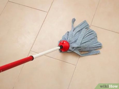 Mopping porcelain floor tiles for a clean and polished finish