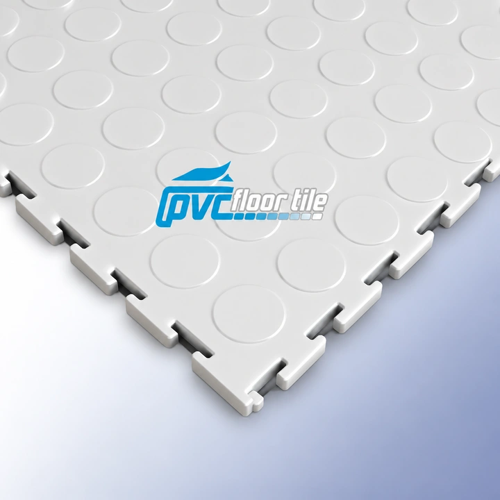 White coin-pattern interlocking PVC floor tile with visible locking edges