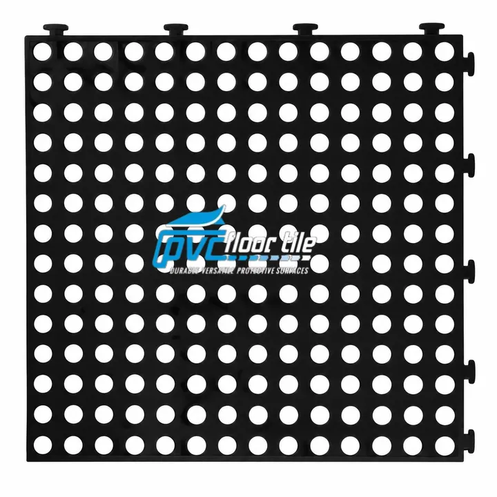DrainDeck interlocking duckboard tile with an open drainage design for wet and high-traffic areas.