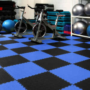 Black and blue interlocking tiles for gym flooring in a home garage