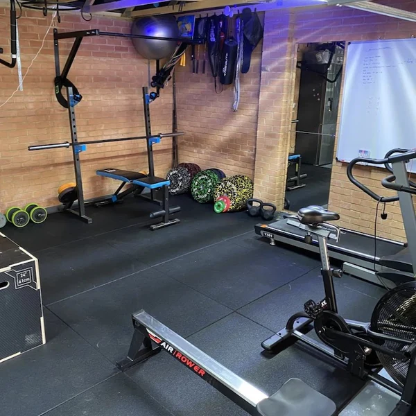 Gym rubber floor tile installed in home gym