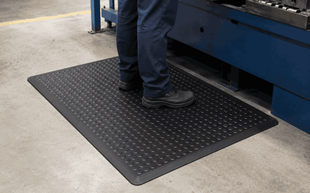 Anti-fatigue rubber mats for work areas used at an industrial workstation