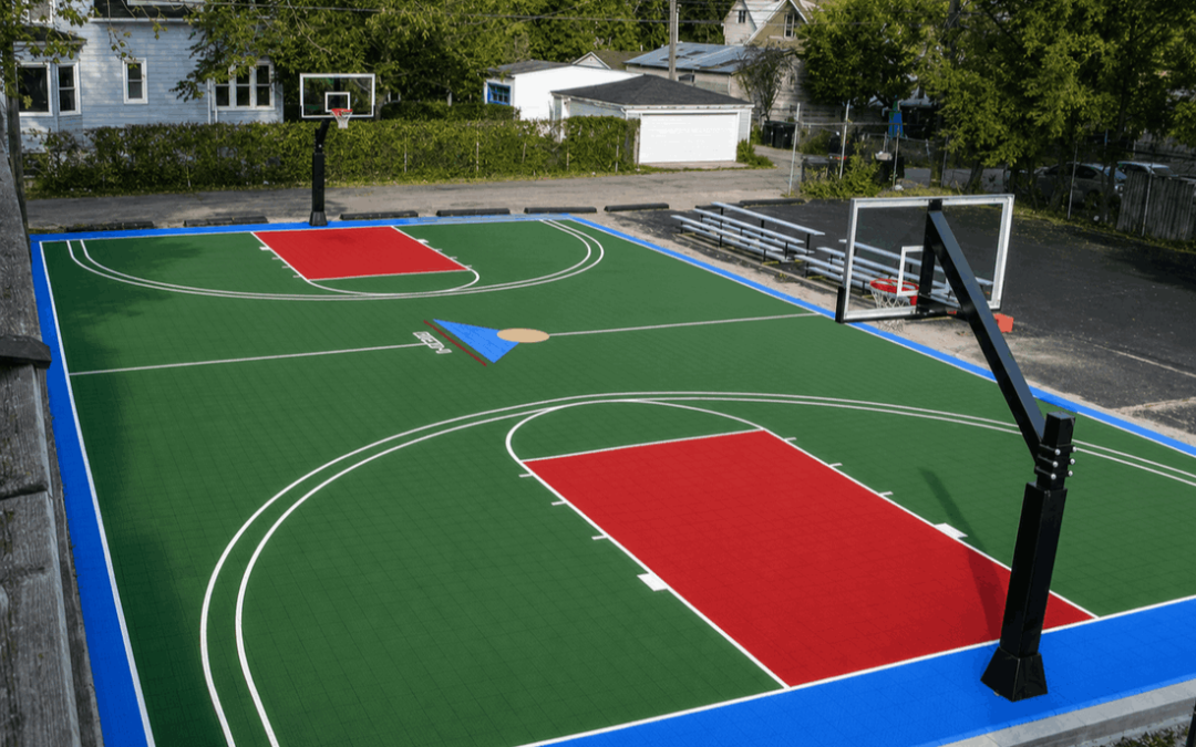 Outdoor basketball court flooring with green and red sports tiles