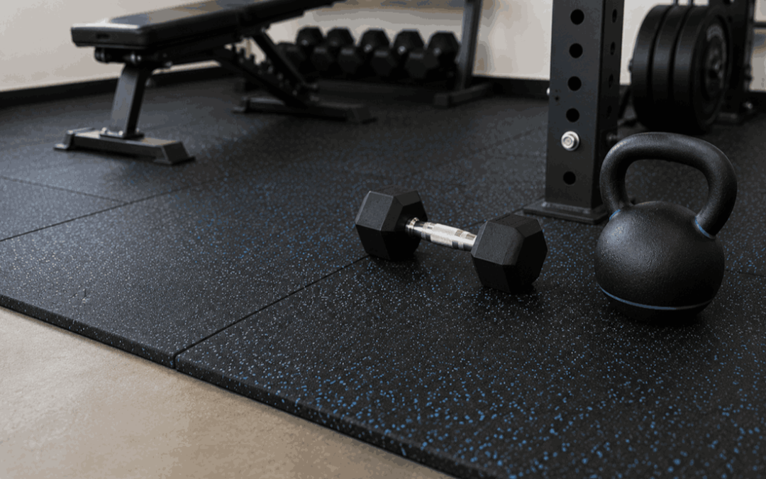 Rubber mats for noise reduction in gym with dumbbell and kettlebell on rubber flooring