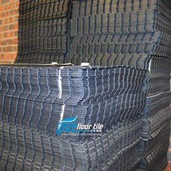 Warehouse storage area containing PVC floor tiles in different colours
