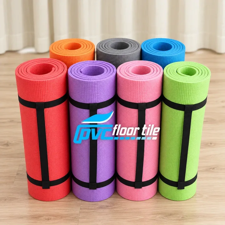 Colourful rolled exercise mats in red purple pink green orange grey and blue