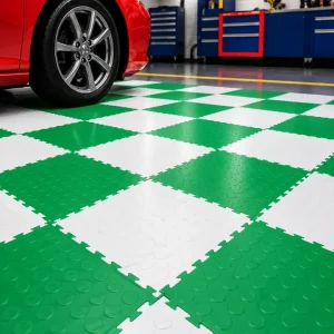 Green and white interlocking PVC garage floor tiles with raised coin surface