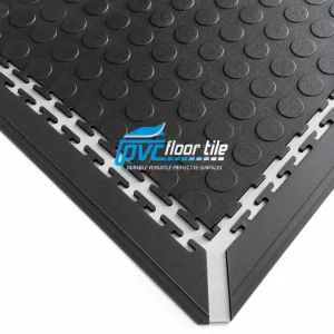 Black PVC interlocking floor tile with raised coin surface and edging trim
