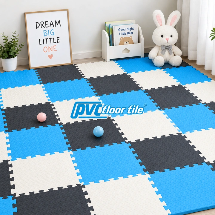 Blue white and dark grey interlocking foam floor tiles in a children's playroom