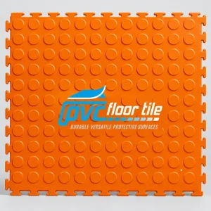 Orange PVC clip-together floor tile with raised coin surface