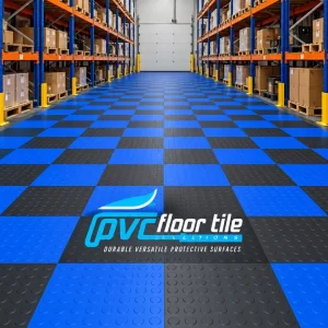 Blue and black interlocking PVC warehouse floor tiles with raised coin surface
