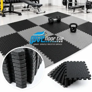 Black and grey interlocking gym floor mats with textured surface
